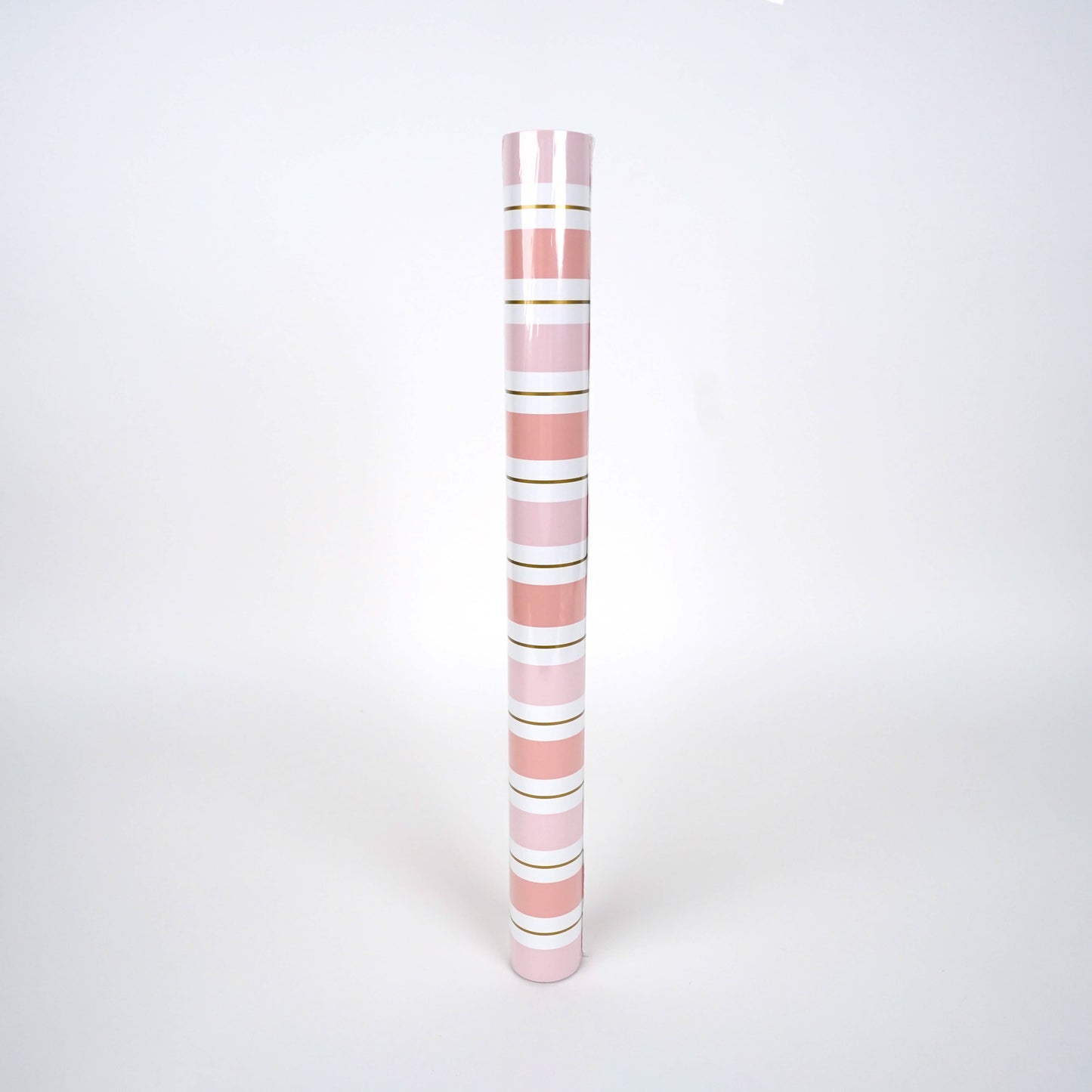 Pink striped paper table runner with white and pink stripes, ideal for festive table settings by Gatherings by Curated Paperie