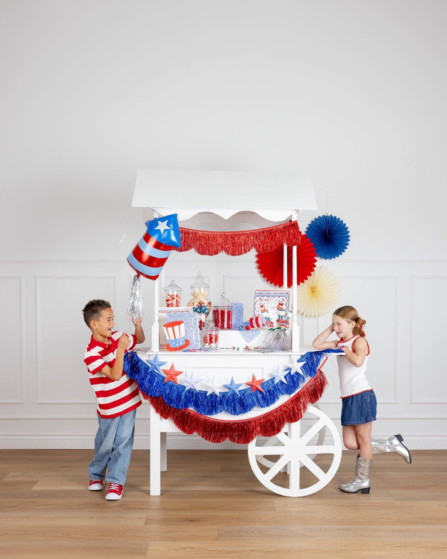 Fringed scallop banner set by My Mind’s Eye featuring colorful scalloped paper banners for party decoration.