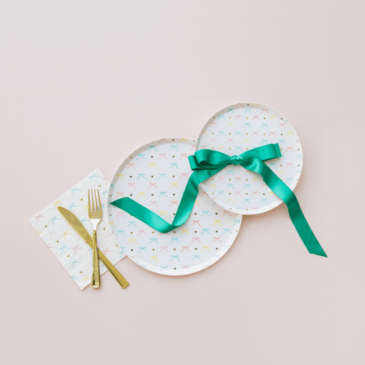Set of 8 Bows Dinner Plates by Jollity & Co. and Daydream Society, 10-inch ceramic plates with colorful bow designs for stylish dining.