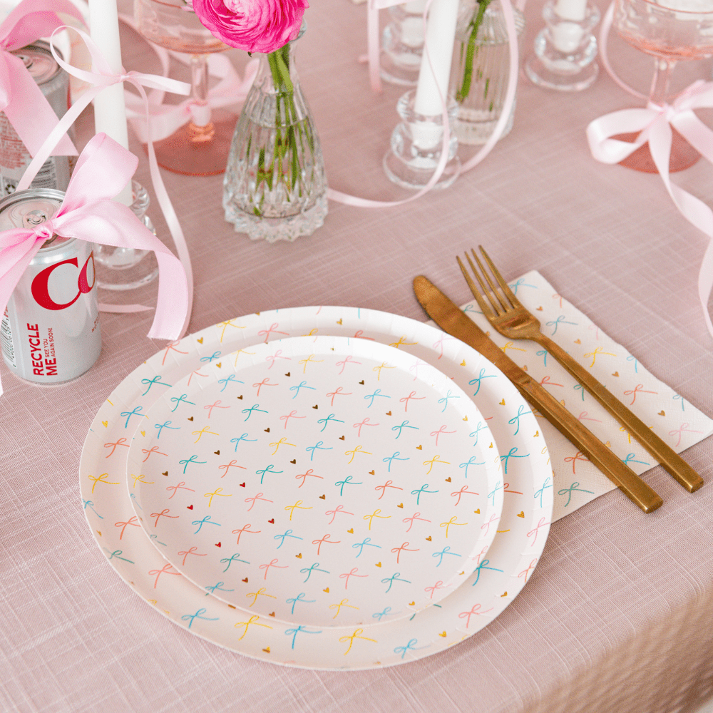 Set of 8 Jollity & Co. Bows 10-inch dinner plates with colorful bow designs, perfect for festive table settings.