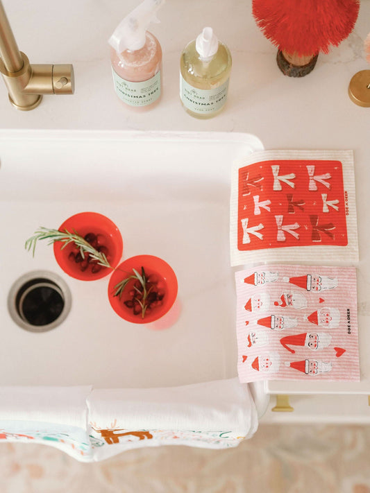 Tie a Bow Swedish Dishcloth by Doe A Deer featuring a colorful bow pattern on a durable, eco-friendly cleaning cloth.