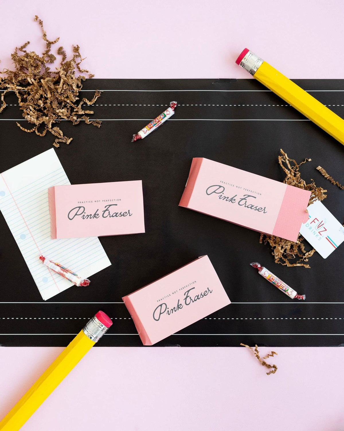 My Mind’s Eye Notebook Paper Dinner Napkins, 24 count, featuring a playful notebook paper design with folded corners and printed lines.