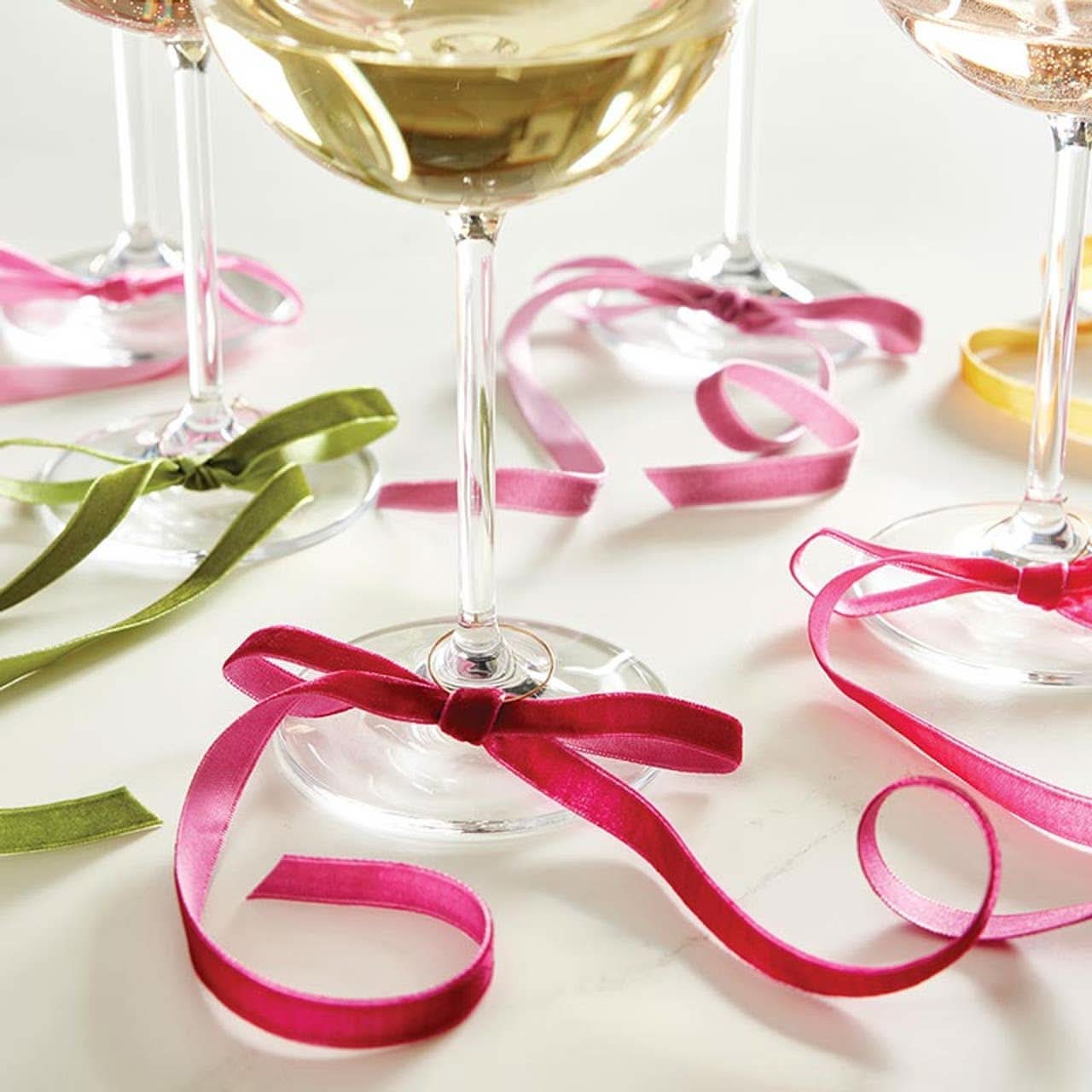 Set of 6 velvet bow wine charms by Santa Barbara Design Studio, colorful decorative accessories for wine glasses.