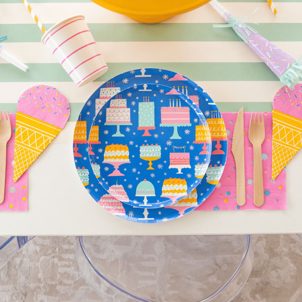Set of 8 large 10-inch birthday cake print paper plates by Jollity & Co. and Daydream Society with colorful cake designs.