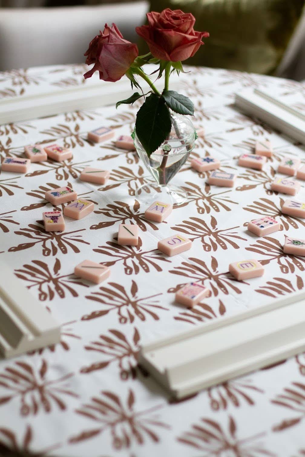 Walnut brown Dragonfly Lures tablecloth by Christina Dickson Home, featuring a detailed dragonfly pattern on smooth fabric.
