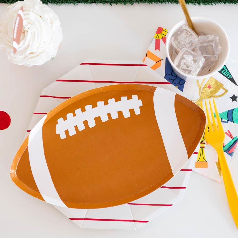 Set of 8 small football-shaped plates by Jollity & Co. and Daydream Society, 10.75 inches, ideal for parties or casual gatherings.