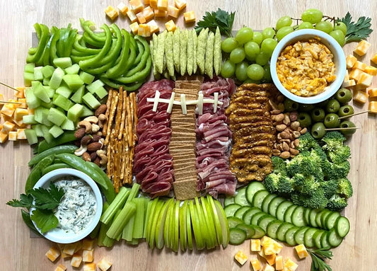 Football-themed charcuterie cheat sheet by Color Box Design & Letterpress, featuring tips for assembling a football-inspired snack platter.