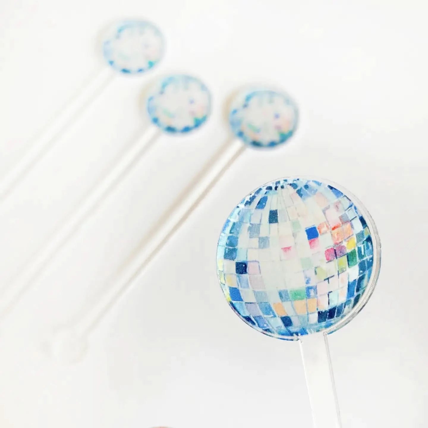 Set of disco ball acrylic stir sticks by Cami Monet featuring shiny, spherical design for stylish cocktail mixing.