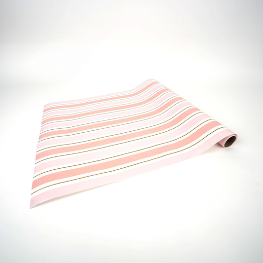 Pink striped paper table runner from Gatherings by Curated Paperie, featuring a vibrant striped pattern on lightweight paper.