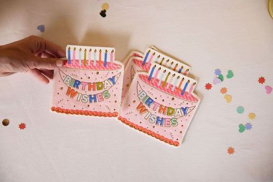 Packed Party Birthday Wishes die-cut cake napkin set with 20 festive paper napkins for birthday celebrations.