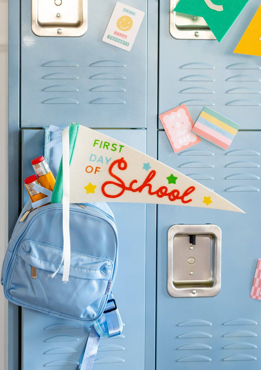 First Day Felt Pennant by My Mind’s Eye featuring a colorful, decorative felt banner for celebrating the first day of school.