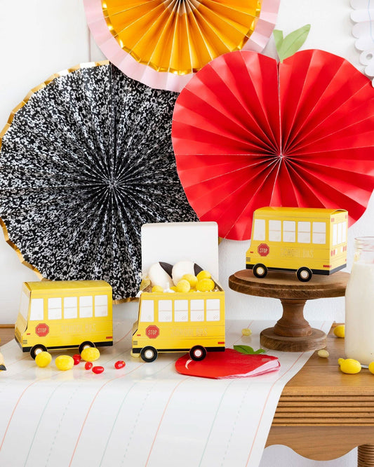 Set of 8 School Bus Treat Boxes by My Mind’s Eye, colorful paper boxes shaped like school buses for party favors or gifts.
