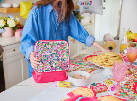 "Packed Party Audrey Jewel Confetti insulated lunch box with colorful confetti design and secure zipper closure."