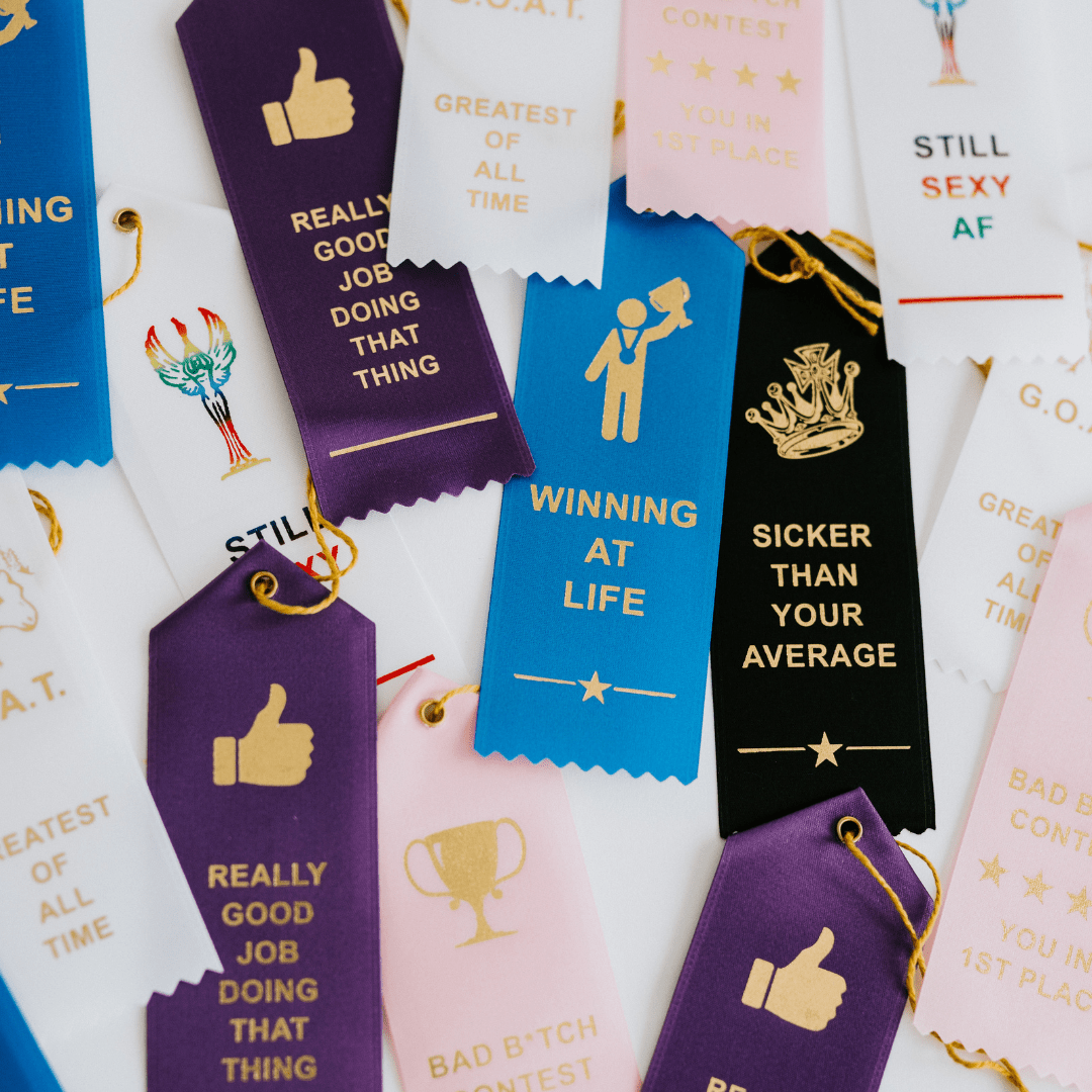 First Cabin Co. "Kind of a Big Dill" award ribbon with yellow and green colors and decorative ribbon details.