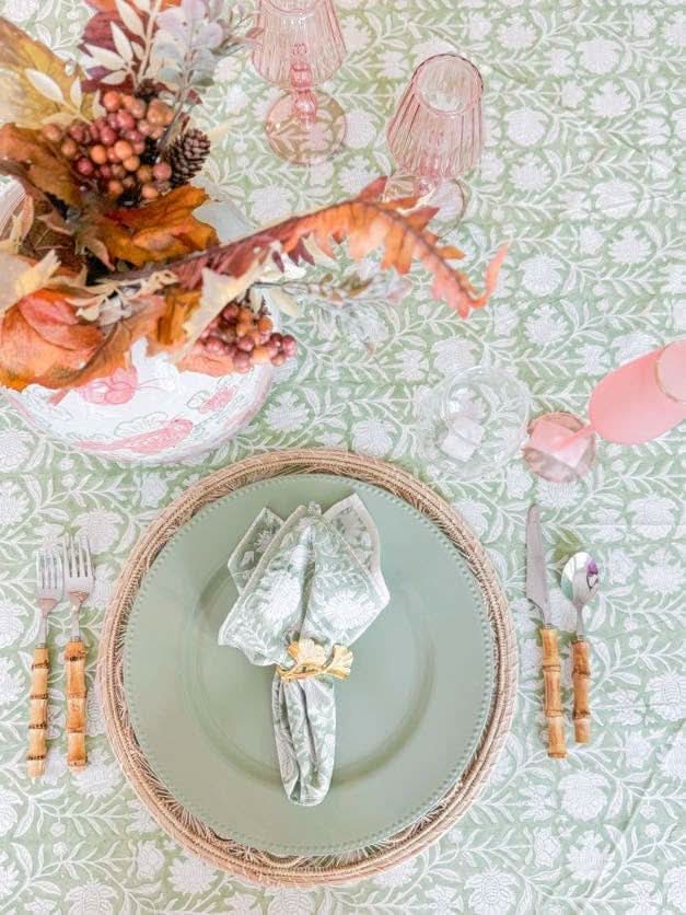 Verdigreen Tablecloth from Verdigris Collection, featuring a lush green leaf pattern on fabric.