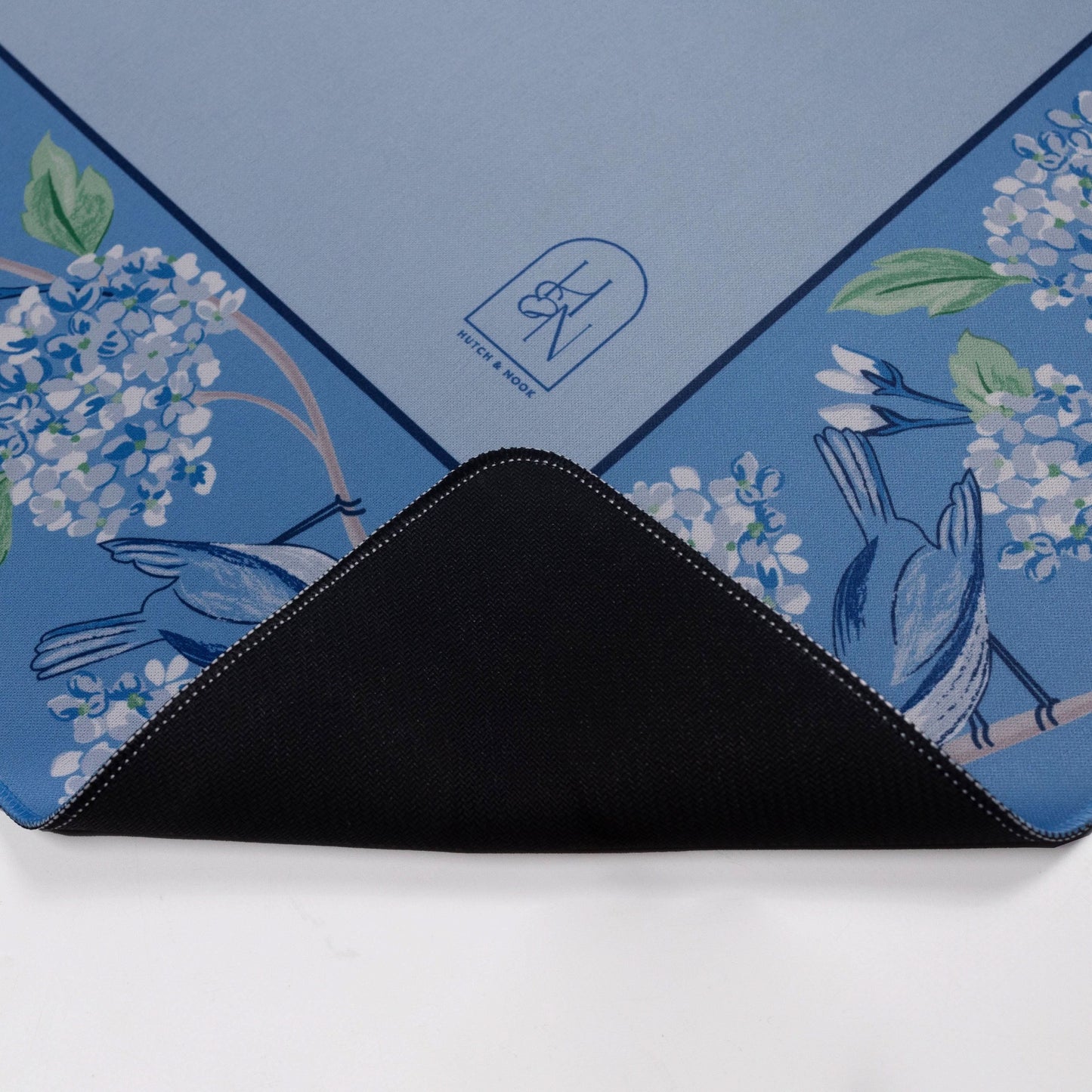 Blue and white bird Mahjong mat by Hutch and Nook, featuring intricate bird patterns on a soft fabric surface.