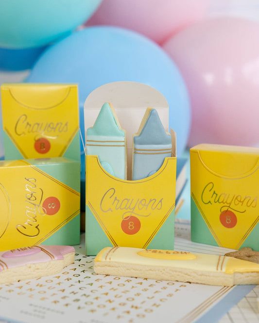 Six colorful Crayon Treat Boxes by My Mind’s Eye, featuring vibrant crayon designs perfect for gift packaging or party favors.