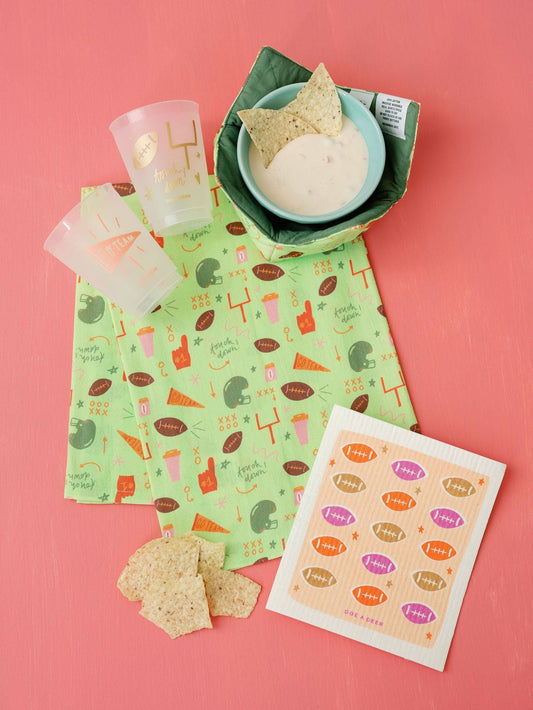 Doe A Deer football fall pattern flour sack towel with vibrant autumn and football design, perfect for kitchen decor or tailgate use.