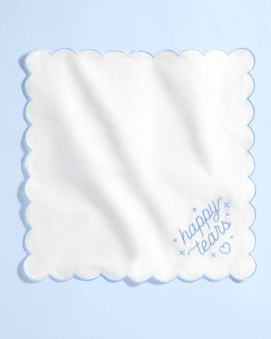 White embroidered handkerchief with "Happy Tears" design by xo, Fetti, featuring delicate embroidery and soft fabric.