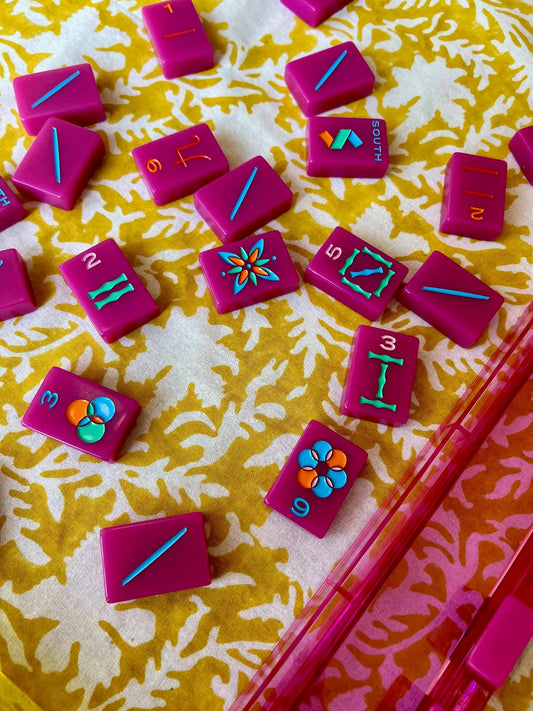 Yellow pressed floral tablecloth by Christina Dickson Home, 60x60 inches, featuring vibrant pressed floral patterns on fabric.