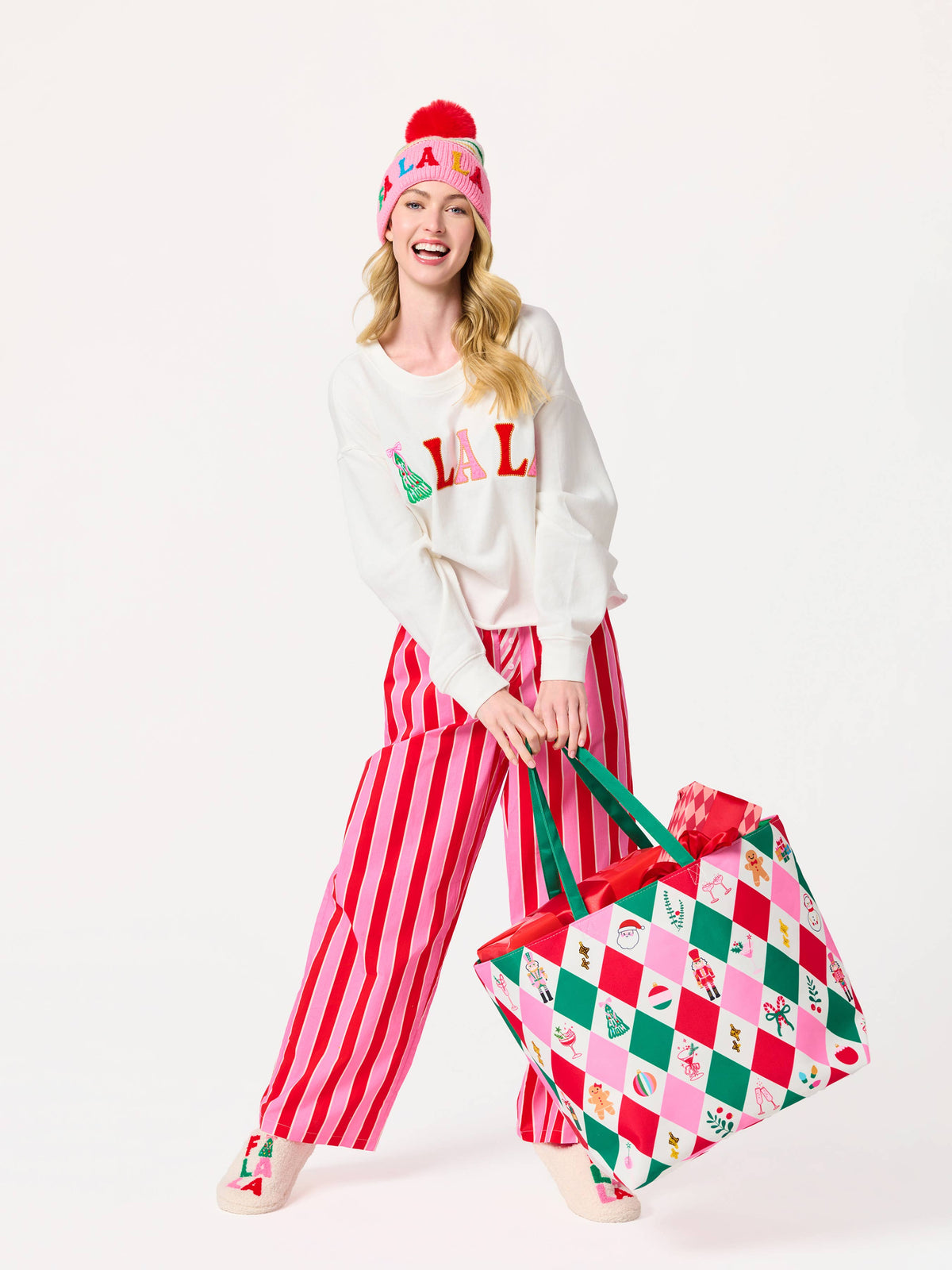 Shiraleah FA LA LA slippers in large/extra-large size with festive red and white design, cozy and soft for holiday comfort.