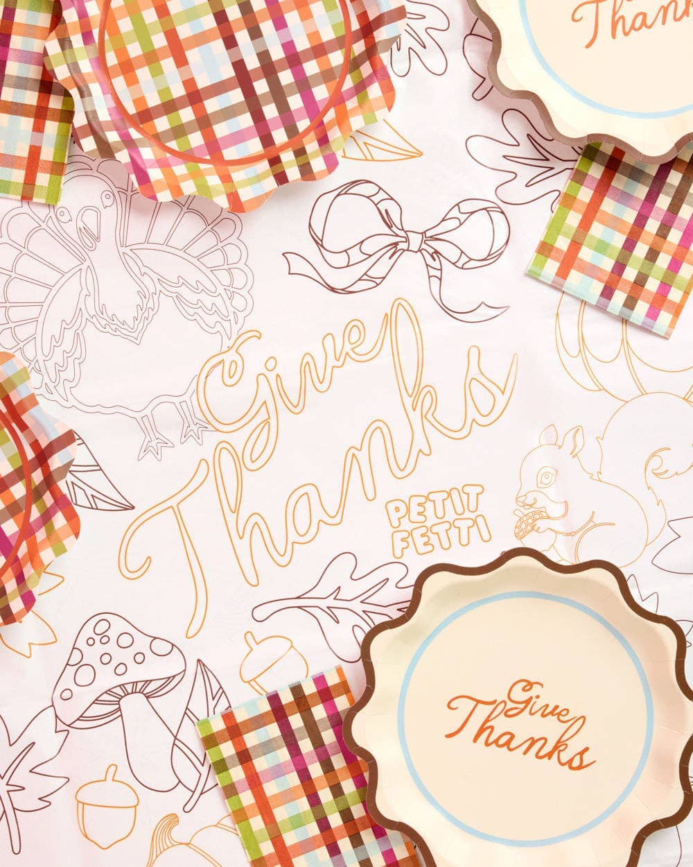 Give Thanks paper tablecloth by xo, Fetti featuring a festive design with autumn leaves and harvest motifs for Thanksgiving celebrations.