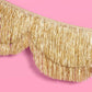 Gold scallop fringe banner from xo, Fetti with layered gold and white scallops and fringe for festive decorations