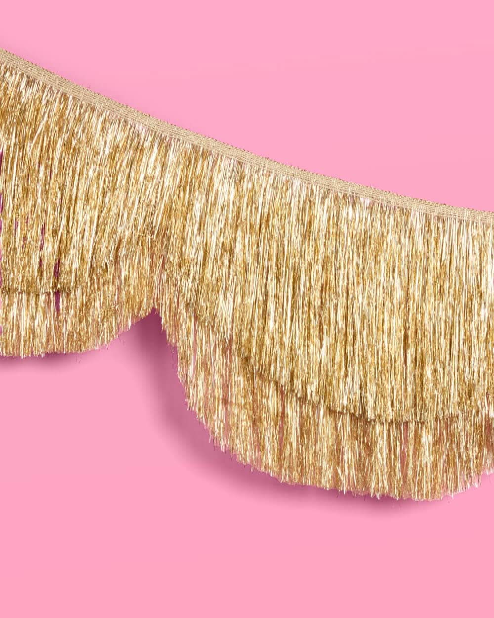 Gold scallop fringe banner from xo, Fetti with layered gold and white scallops and fringe for festive decorations