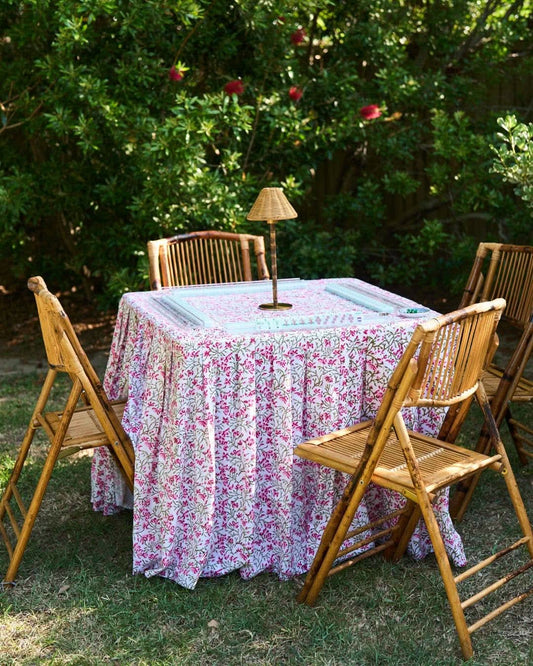 Elizabeth tablecloth by The Gilded Grasshopper featuring elegant fabric with intricate floral embroidery on a white background.