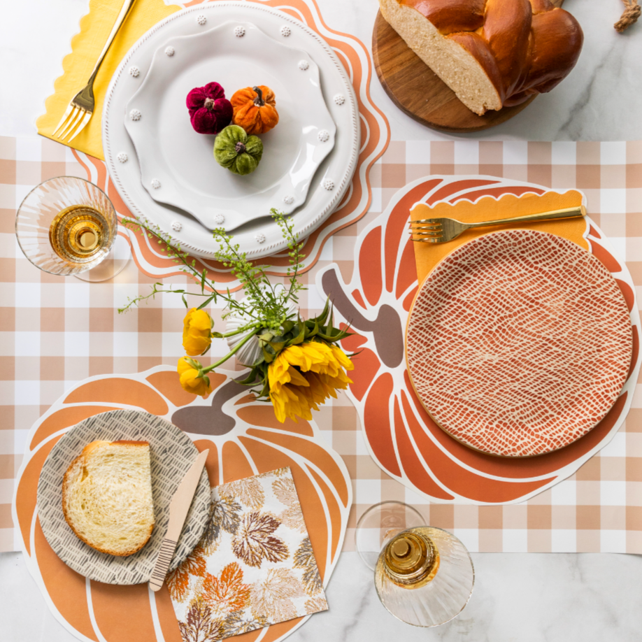 Brown gingham paper table runner with a classic checkered pattern, ideal for casual dining or party table decor.