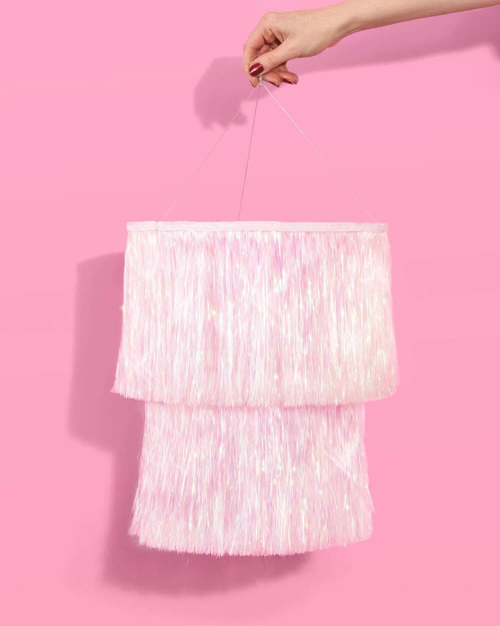 Iridescent sparkly party chandelier with shimmering, reflective hanging crystals and a glamorous, festive design from xo, Fetti.