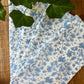 Set of four Christina Dickson Home Whimsy Floral Napkins in Sorrento Blue with vibrant floral pattern for elegant table settings.