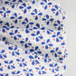 Set of four Christina Dickson Home Petals Napkins in vibrant royal blue, featuring a floral petal design for elegant table settings.