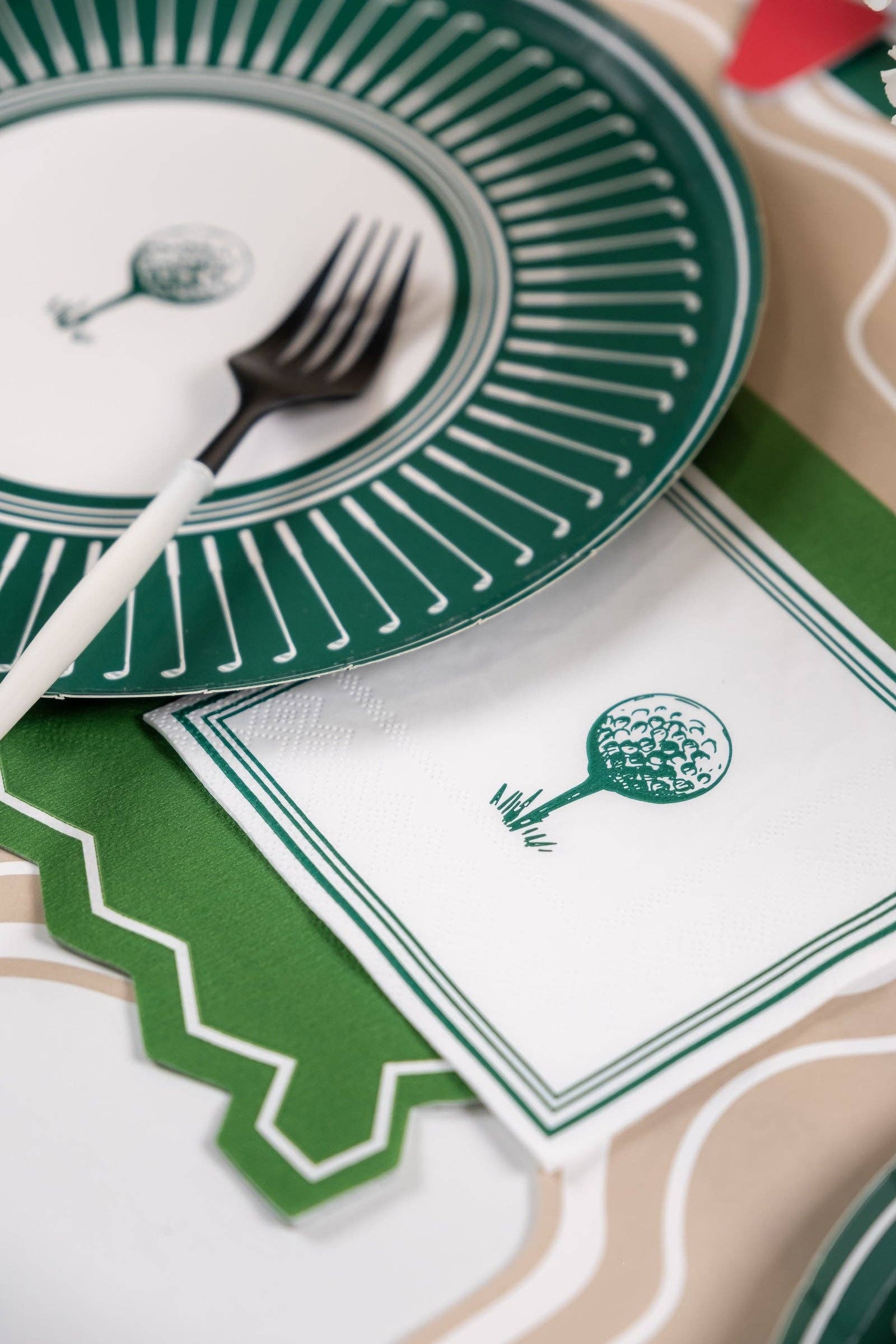 Set of 16 Golf-themed beverage napkins with printed golf ball and flag designs, ideal for golf parties and gatherings.