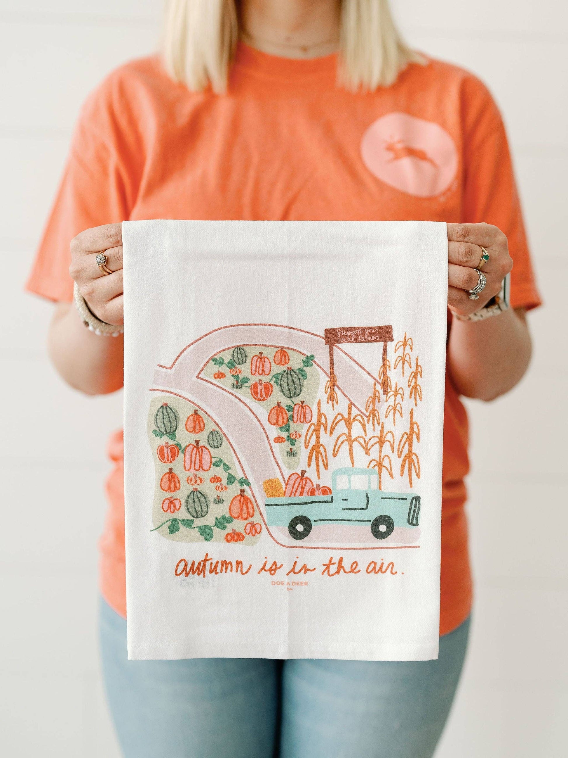 Doe A Deer Autumn is in the Air Flour Sack Towel featuring fall-themed design with autumn leaves and cozy seasonal imagery.