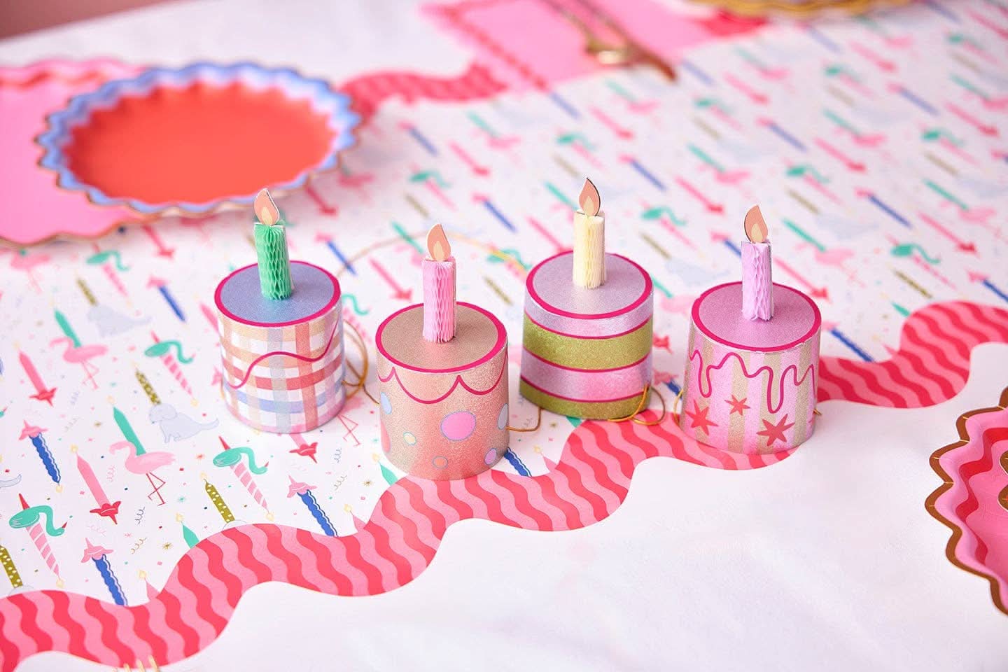 Set of four mini birthday cake-themed party hats by Packed Party, colorful and festive for celebration accessories.