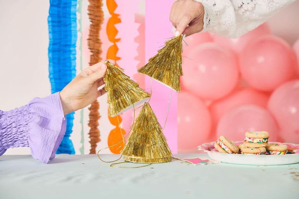Set of four Golden Girl Mini Gold Fringe Party Hats by Packed Party, featuring shiny gold fringe for festive celebrations.