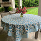 Blue Pinwheel Tablecloth by Christina Dickson Home, 120x70 inch rectangle, featuring a vibrant bluebird pattern on fabric.