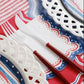 Patriotic 4th of July cocktail napkin with red, white, and blue stars and stripes from Gatherings by Curated Paperie.