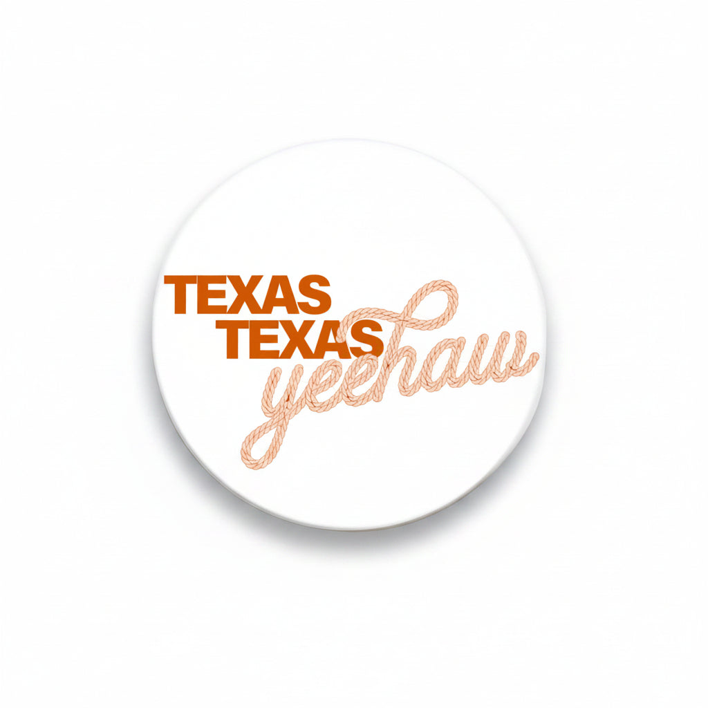 University of Texas Yeehaw button by Good Vibez Collegiate featuring a colorful cowboy hat and "Yeehaw" text on a round metal badge.