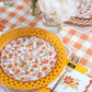 Set of two autumn floral dessert plates by Gatherings by Curated Paperie with colorful fall-inspired floral designs.