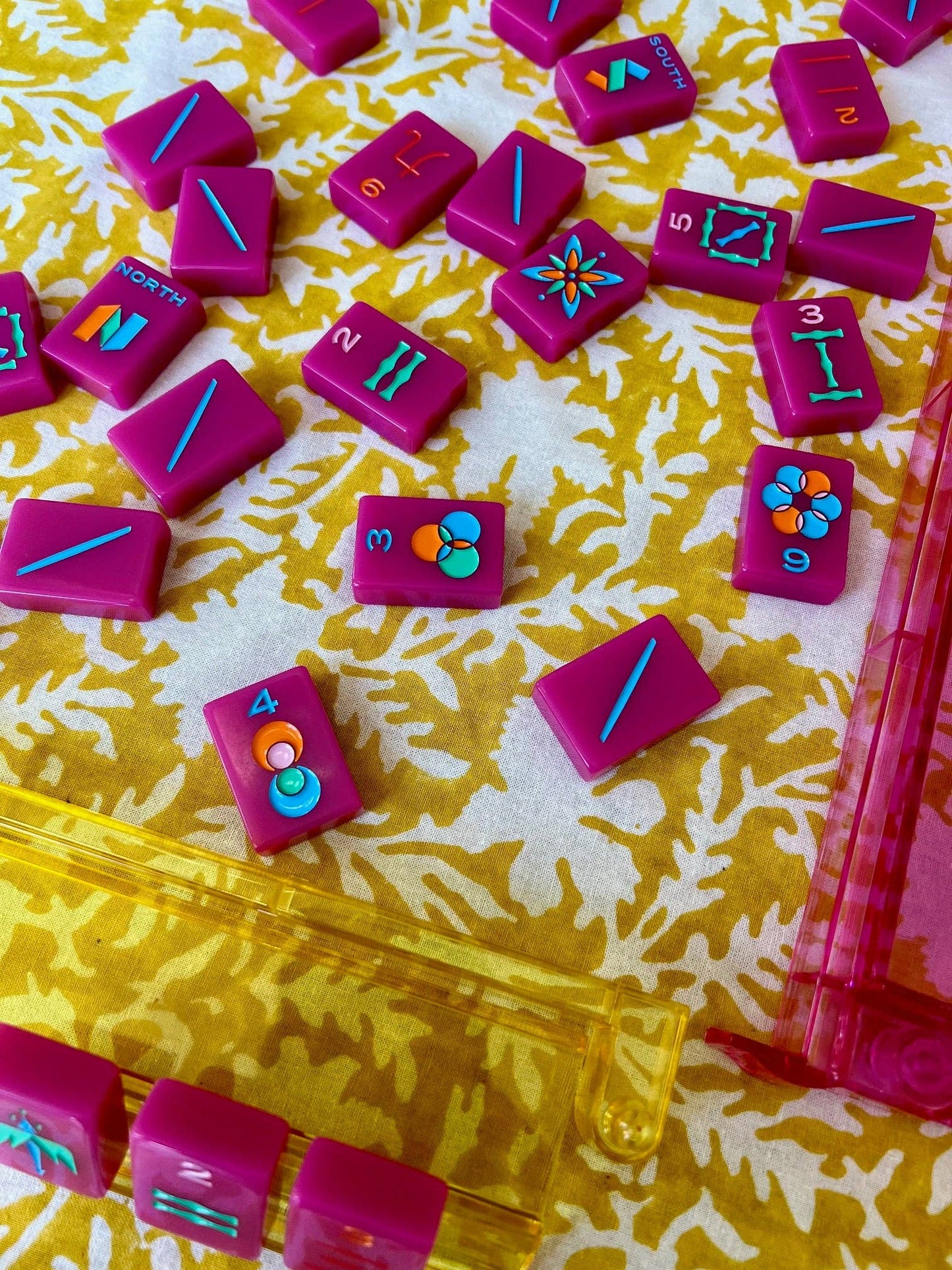 Pressed Florals yellow tablecloth by Christina Dickson Home, 60x60 inches, featuring vibrant pressed floral pattern on fabric.