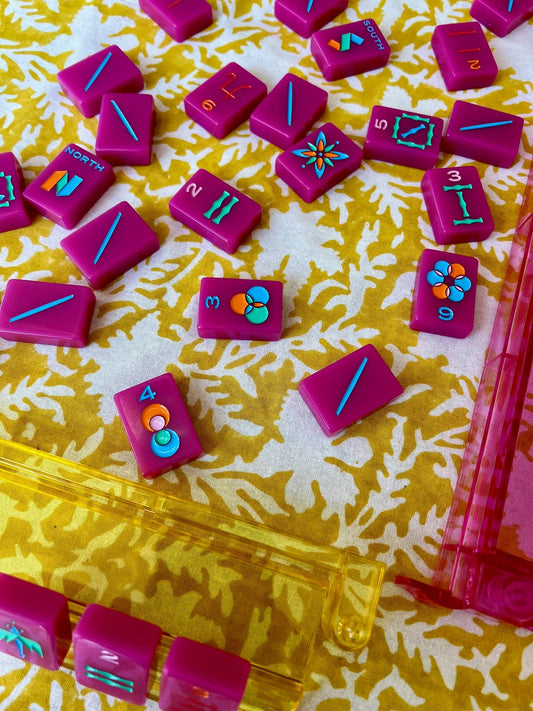 Pressed Florals yellow tablecloth by Christina Dickson Home, 60x60 inches, featuring vibrant pressed floral pattern on fabric.