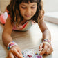 Little Stacks The Shell Kit featuring colorful, textured shell-shaped stacking blocks for children’s play and learning.
