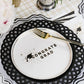 Set of three black Basketweave dinner paper plates from Gatherings by Curated Paperie with textured woven design.