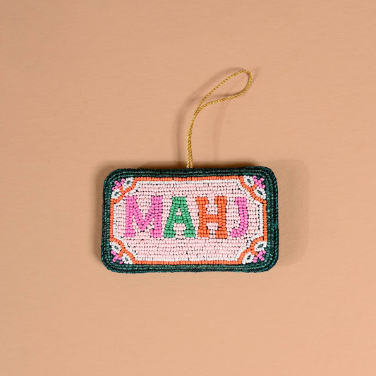 Handcrafted beaded Mahj ornament featuring colorful beads and intricate design by The Darling Effect.