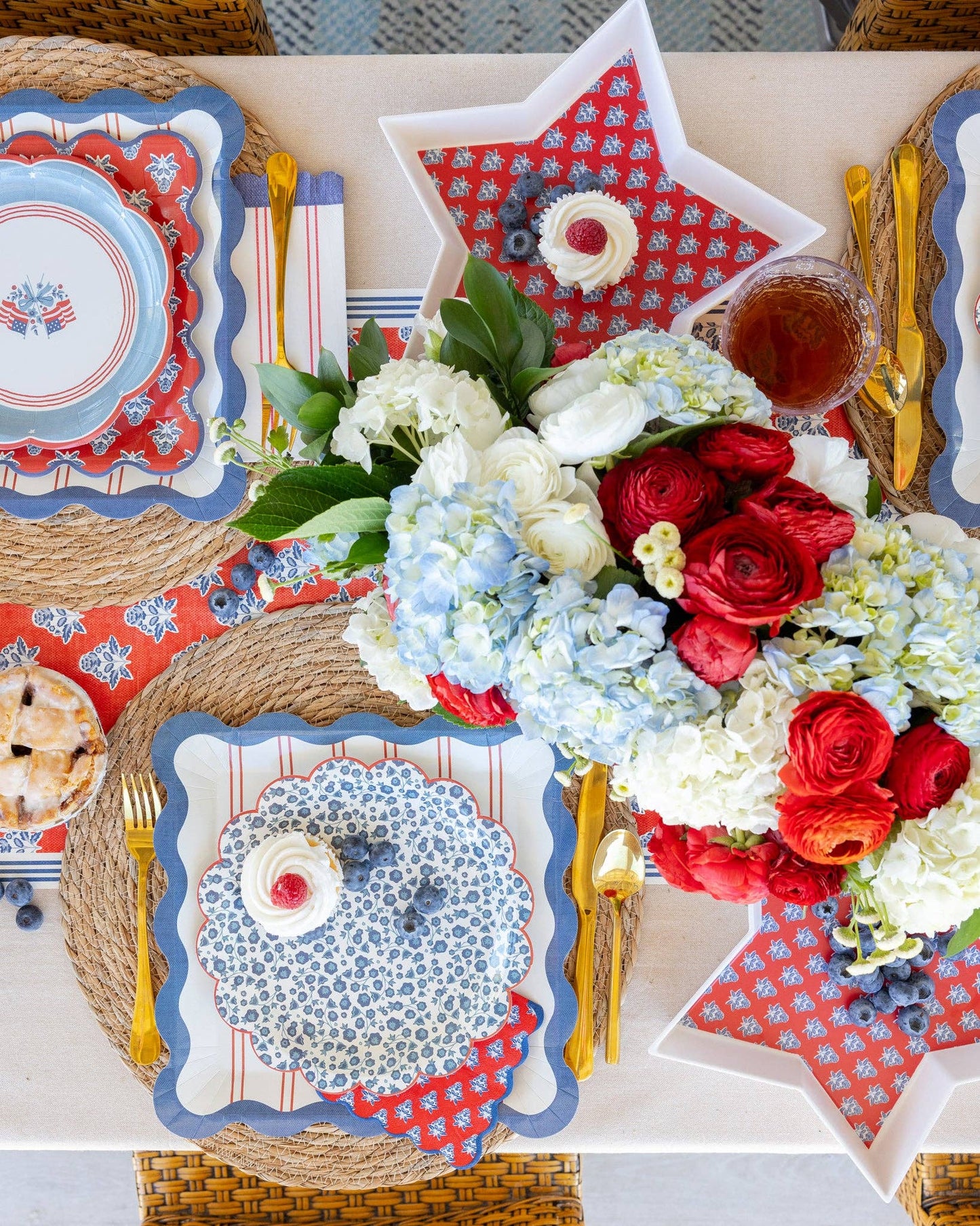 Blue Ditsy Floral Paper Plate by My Mind’s Eye featuring a delicate floral pattern on round paper dish.