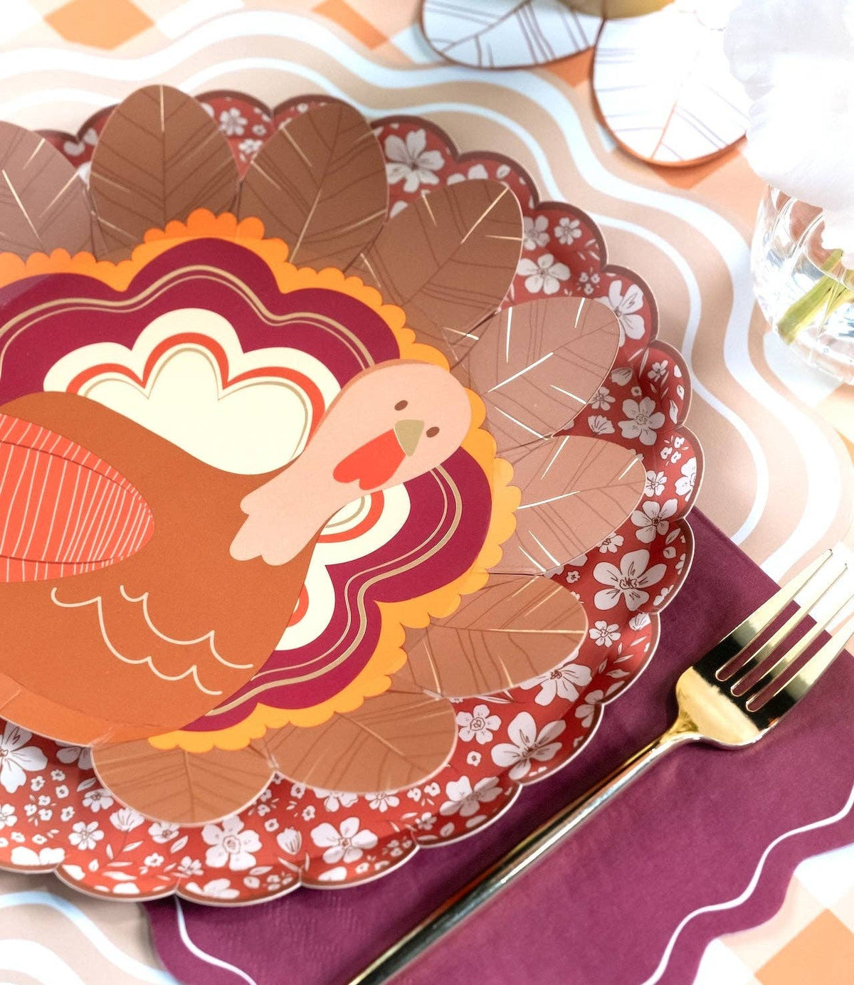 Thanksgiving turkey-shaped plates from Gatherings by Curated Paperie, featuring festive ceramic dinnerware with turkey design.