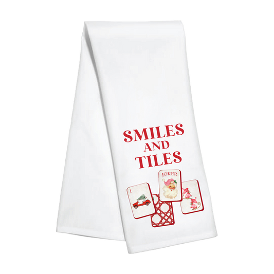 Kitchen towel featuring holiday smiles and tile patterns from Toss Designs, showcasing festive design and soft fabric.