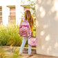 Pink Bows and Confetti Backpack by Packed Party showing colorful bow and confetti design on a stylish backpack.